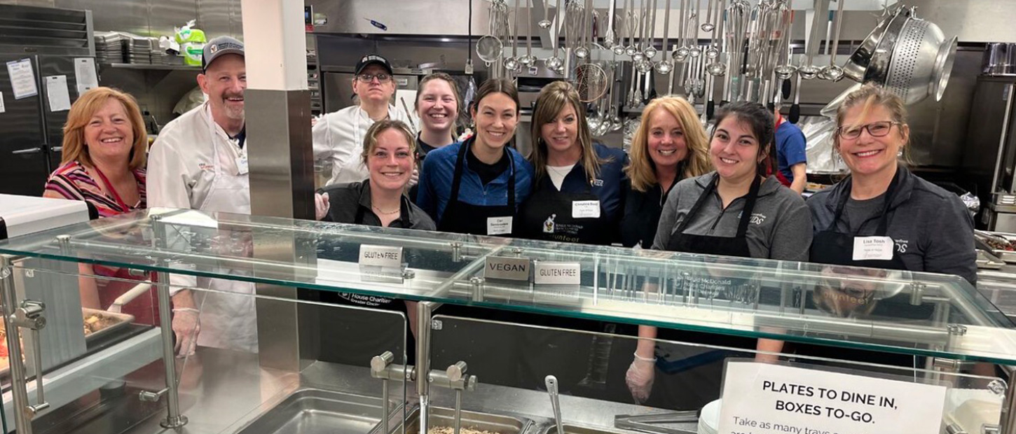 Group of Taste of Hope volunteers standing in kitchen